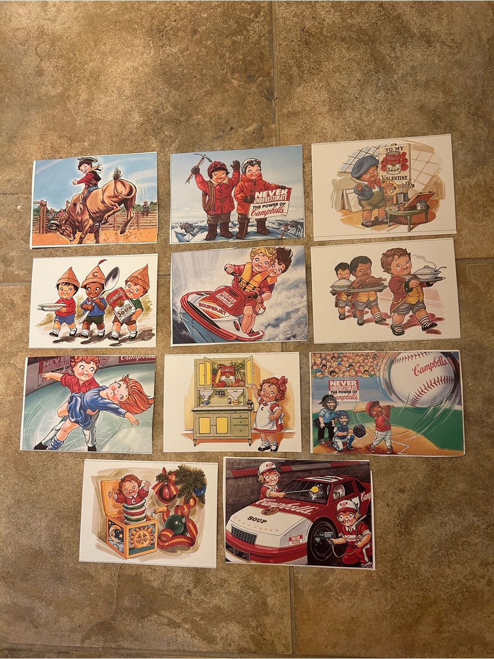 11 unused vintage postcards of the Campbell Soup Kids doing various activities